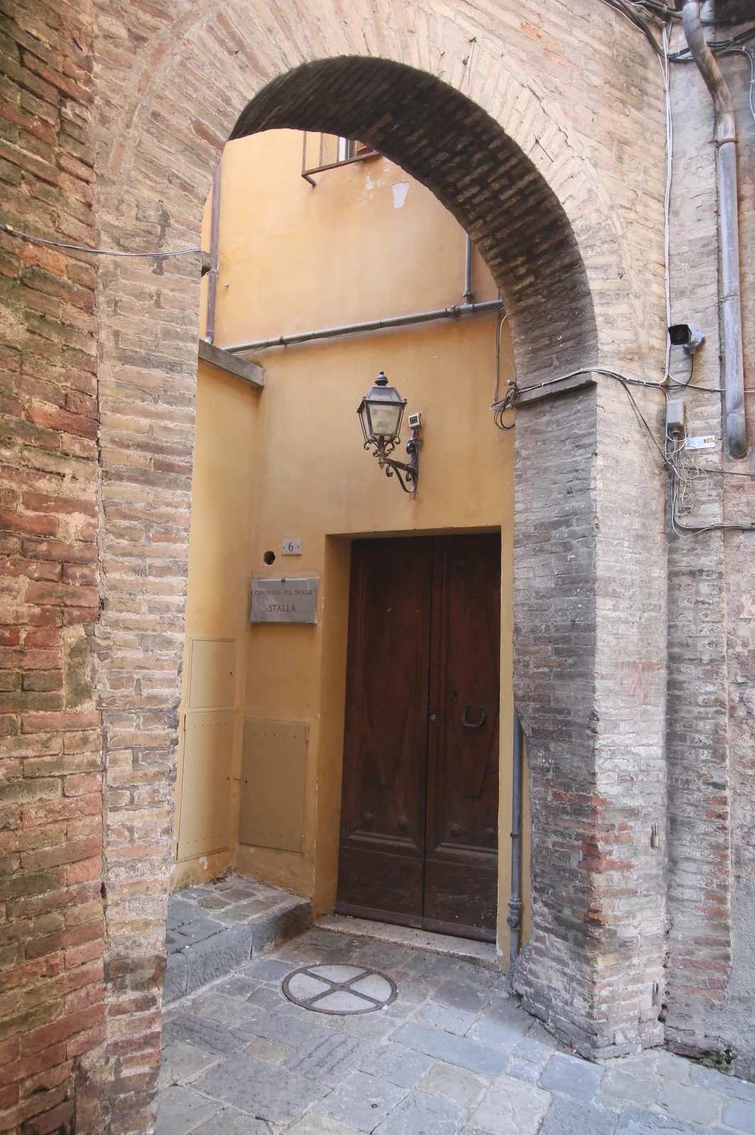 A quiet contrada street in Siena
