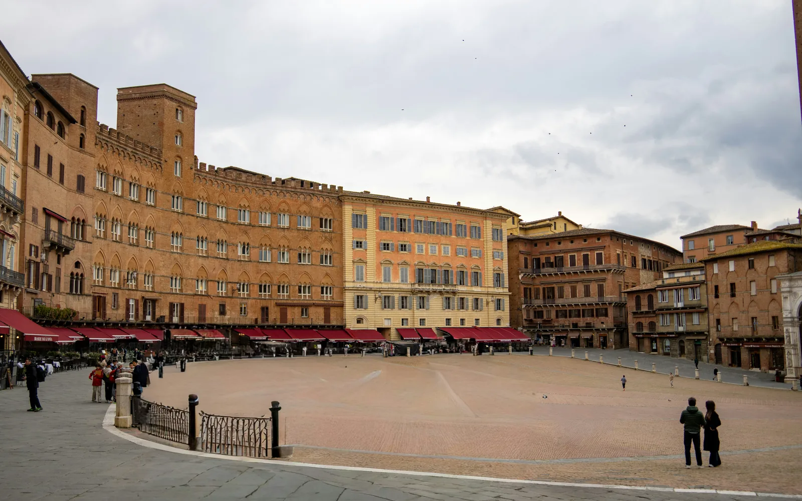 Piazza del Campo surrounded by historic medieval buildings in Siena
