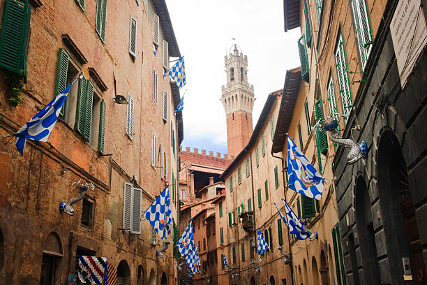 Colourful flags in Siena's contrade streets