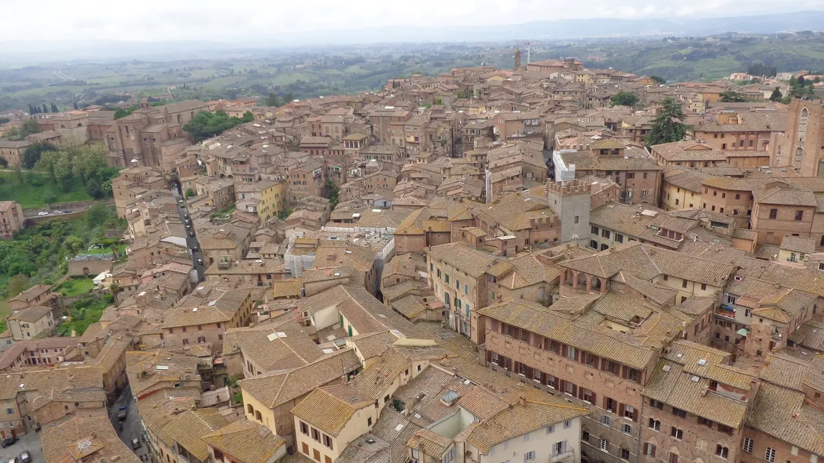 Terracotta rooftops of Siena under winter light