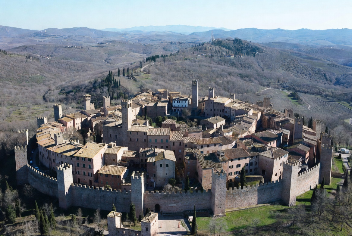 Thick stone buildings and wooden shutters inside the walled village of Monteriggioni, Tuscany